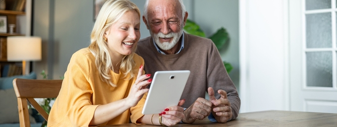 daughter and father on ipad